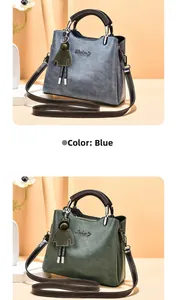 Detail view of the vintage oil wax PU leather shoulder bags with elegant doll charm