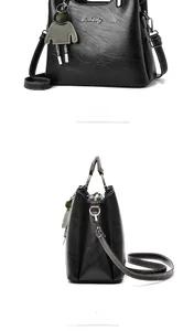 Close-up of black oil wax PU leather bag with logo detail and adjustable shoulder strap