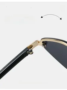 Macro detail of durable metal hinge on vintage polygon sunglasses with gold screw link