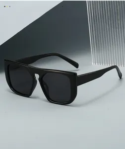 Side view of square oversized black sunglasses with a retro 45-degree angle profile