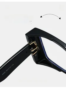 Detail of durable gold metal hinge and frame specifications on stylish black glasses