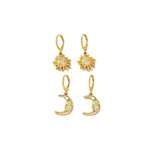 Golden sun and moon face dangle hoop earrings in a polished minimalist style