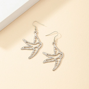 Minimalist silver swallow bird drop earrings with hollow design and textured finish