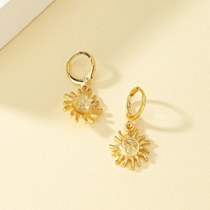 Elegant gold sun face drop hoop earrings with intricate vintage carved sunburst details