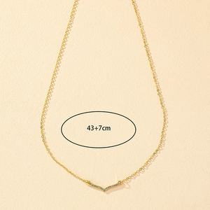 Elegant gold V-shaped necklace with shimmering crystals and 43+7cm adjustable chain