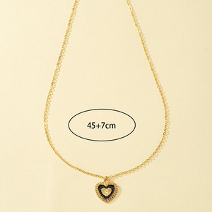 Collier cœur vintage doré avec pendentif en émail noir et chaîne ajustable de 45cm