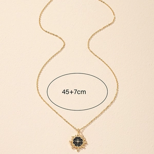 Golden sun enamel star pendant necklace with 45+7cm chain on beige background