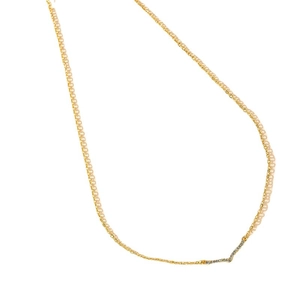 Elegant gold V-shaped necklace with micro-paved sparkling crystals on a white background