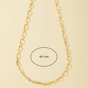 Detail of golden paperclip link chain necklace showing 45+7cm length measurement