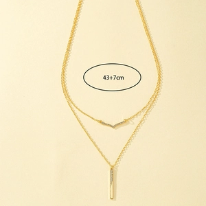 Elegant double-layered gold necklace with V-shape and bar pendants with zircons