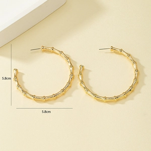 Minimalist golden C-shape bamboo hoop earrings with a 5.8cm diameter and polished finish