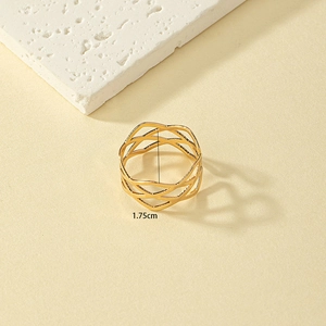 Detail shot showing 1.75cm diameter of golden hollow geometric grid ring