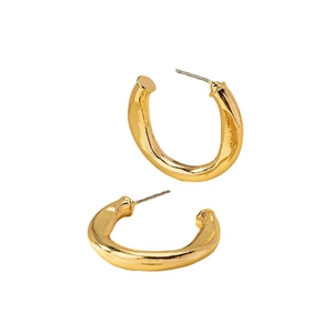 Minimalist thick irregular twisted gold C-shape hoop earrings with polished finish