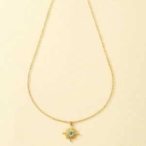 Goldene Sternanhänger-Halskette mit Türkis-Stein an einer minimalistischen Kette