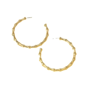Golden bamboo-textured C-shaped hoop earrings with a minimalist metallic finish