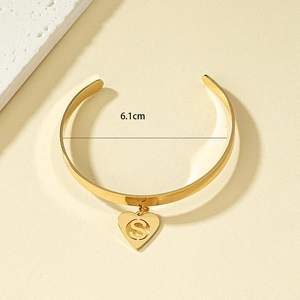 Minimalist gold heart bangle with letter S pendant, 6.1cm diameter open cuff style