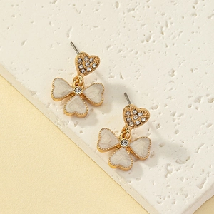 Golden heart stud earrings with white enamel four-leaf clover drop and sparkling crystals
