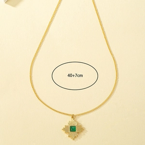 Detail of gold necklace showing 40+7cm chain length and green stone pendant specs