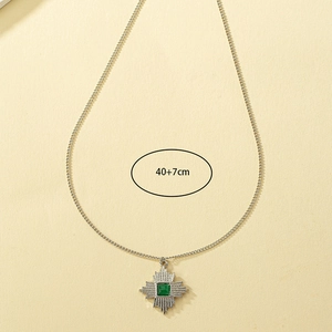 Detail view of vintage star pendant necklace with green stone and 40+7cm chain length