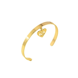 Golden open bangle bracelet featuring a heart-shaped charm with cutout letter S design