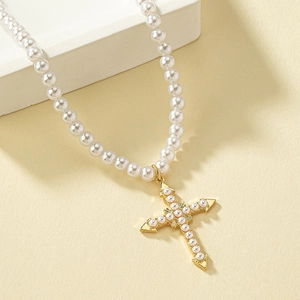Elegant pearl bead necklace featuring a vintage gold cross pendant with inset pearls