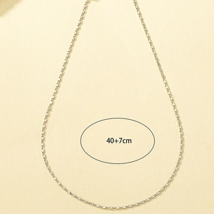 Detailed close-up of minimalist silver chain necklace measuring 40+7cm in length