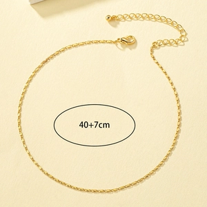 Detailed shot of gold flat link chain necklace with 40+7cm adjustable lobster clasp closure