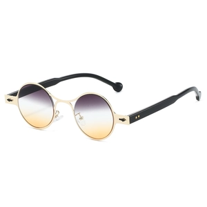 Retro oval sunglasses with gold metal frames and purple-orange gradient lenses