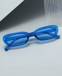 Detail view of retro narrow rectangle sunglasses with transparent blue frame and hinges