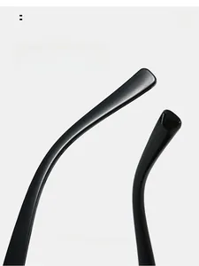 Detail of ergonomic curved black temple tips on oval sunglasses for comfortable wear