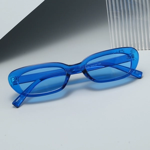 Fashionable oval transparent blue sunglasses with minimalist narrow frame for women