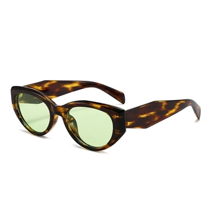 Vintage cat-eye sunglasses with tortoise frame and light green lenses in a high-quality finish
