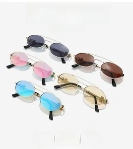 Detail showing five colored oval sunglasses with metal frames in gray, pink, and brown