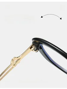 Close-up of durable metal hinge on black trendy sunglasses with golden wave design