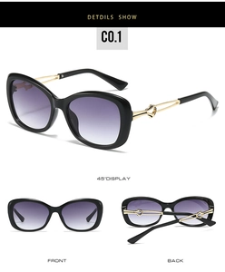 Detail view of square fashion sunglasses with purple gradient lenses and gold metal accents