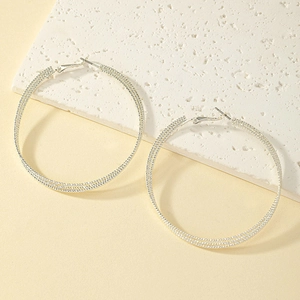 Three-layer silver twisted hoop earrings with textured finish in a stylish modern design