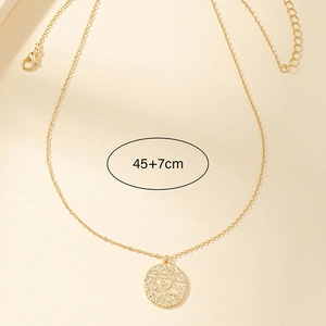 Detail of gold sun coin pendant necklace with 45+7cm chain length measurement