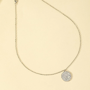 Elegant silver sun coin pendant necklace with a vintage embossed round medal design