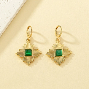 Vintage gold hoop earrings with green cat eye stone in a sunburst geometric design