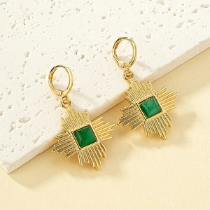 Golden leverback earrings with sunburst design and green cat eye stone pendant