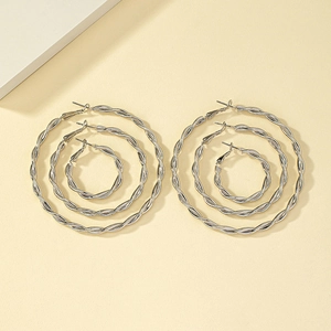 Three pairs of silver twisted hoop earrings in small, medium, and large sizes