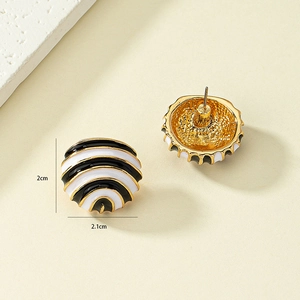 Retro vintage gold plated enamel hoop earrings with black and white striped patterns