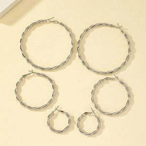 Three pairs of silver twisted hoop earrings in small, medium, and large sizes