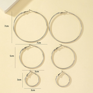 Detailed size comparison of 7cm, 5cm, and 3cm silver hoop earrings set for women