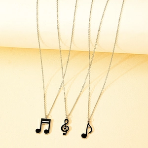 Three-piece musical note necklaces with black enamel treble clef and quaver symbols