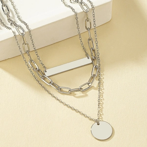 Three-layer silver necklace with paperclip chain, rectangle bar and circle pendants
