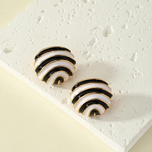 Minimalist enamel hoop earrings with black and white stripes on a natural stone base