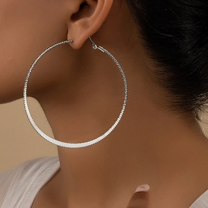 Polished silver textured oversized hoop earrings for women showing high metal refraction