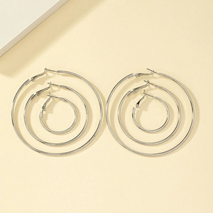 Three-pair silver hoop earring set featuring small, medium, and large minimalist rings