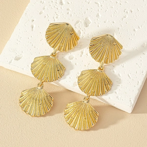 Golden multi-layer seashell drop earrings with textured finish for elegant resort style
